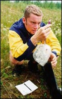 Charles weighing a Wood Frog